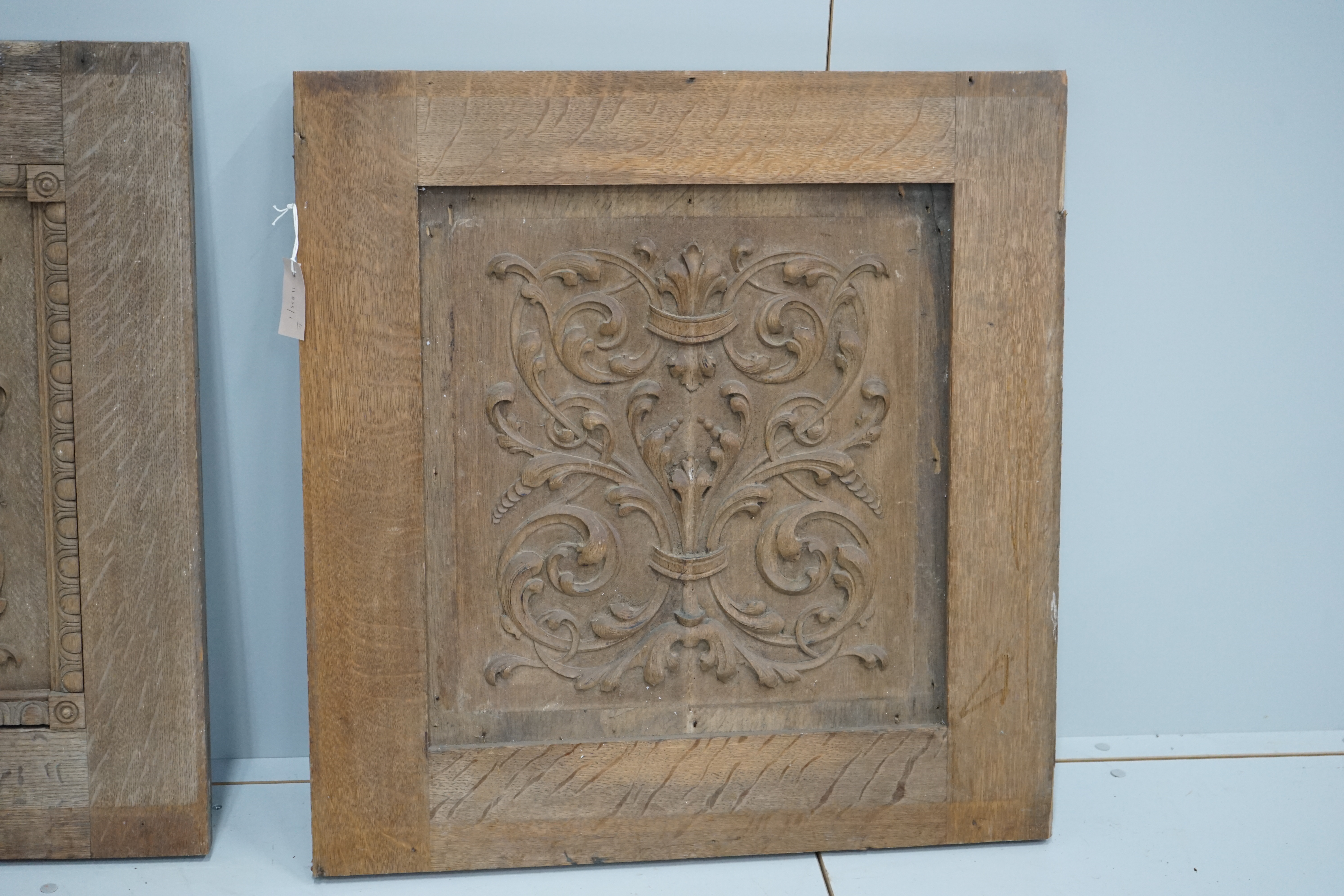 A pair of late 19th century carved oak panels, width 71cm, height 74cm